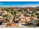 Aerial view of house and neighborhood, showcasing desert landscape at 841 Glitter Glen Ct, Las Vegas, NV 89123