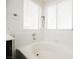 Bathroom featuring a large soaking tub and window at 841 Glitter Glen Ct, Las Vegas, NV 89123