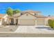 Two-story house with three-car garage and desert landscaping at 841 Glitter Glen Ct, Las Vegas, NV 89123