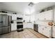 Updated kitchen featuring white cabinets and stainless steel appliances at 841 Glitter Glen Ct, Las Vegas, NV 89123