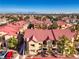 Aerial view of a community with red tile roofs and mountain views at 900 Heavenly Hills Ct # 217, Las Vegas, NV 89145