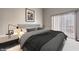 Main bedroom with a king-size bed and gray color scheme at 900 Heavenly Hills Ct # 217, Las Vegas, NV 89145