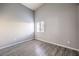 Well-lit bedroom featuring wood-look flooring and a window at 900 Heavenly Hills Ct # 217, Las Vegas, NV 89145