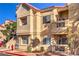 Tan two-story building with red tile roof, stairs, and a fire hydrant at 900 Heavenly Hills Ct # 217, Las Vegas, NV 89145