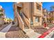 Tan building exterior with stairs and a fire hydrant at 900 Heavenly Hills Ct # 217, Las Vegas, NV 89145