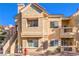 Tan two-story building with red tile roof, stairs, and a fire hydrant at 900 Heavenly Hills Ct # 217, Las Vegas, NV 89145