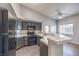 Modern kitchen with dark gray cabinetry and white countertops at 900 Heavenly Hills Ct # 217, Las Vegas, NV 89145