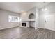 Living room with gray flooring and a corner fireplace at 900 Heavenly Hills Ct # 217, Las Vegas, NV 89145