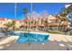 Sparkling community swimming pool with surrounding patio at 900 Heavenly Hills Ct # 217, Las Vegas, NV 89145