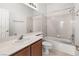 Well-lit bathroom featuring a shower-tub combo and a large mirror over the vanity at 10929 Mount Royal Ave, Las Vegas, NV 89144