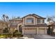 Two-story house with a landscaped yard and a two-car garage at 10929 Mount Royal Ave, Las Vegas, NV 89144