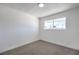 Spacious bedroom with large window, new carpet and ceiling light at 1302 Cherokee Ln, Las Vegas, NV 89106