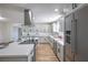 Modern kitchen with white cabinets and stainless steel appliances at 1302 Cherokee Ln, Las Vegas, NV 89106