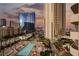Resort pool and city view from above at 135 E Harmon Ave # 407, Las Vegas, NV 89109