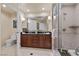 Bathroom featuring a walk-in shower, vanity with drawers, and a toilet at 135 E Harmon Ave # 407, Las Vegas, NV 89109