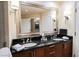 Elegant bathroom with double sink vanity and an oversized mirror at 135 E Harmon Ave # 407, Las Vegas, NV 89109