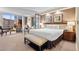 Bright hotel bedroom featuring a king-size bed, a window with a view, and elegant decor for relaxation at 135 E Harmon Ave # 407, Las Vegas, NV 89109