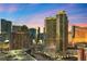 Stunning city view of luxury high-rise buildings at dusk, with ample parking available at 135 E Harmon Ave # 407, Las Vegas, NV 89109