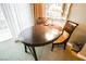Intimate dining area offers a dark wood table and chairs, perfect for enjoying meals at 135 E Harmon Ave # 407, Las Vegas, NV 89109