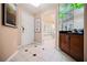 Hotel entryway featuring tiled floors, a closet, and an entry to the bathroom and access to amenities at 135 E Harmon Ave # 407, Las Vegas, NV 89109
