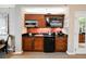 Well-equipped kitchenette has a microwave, sink, and mini-fridge, set in efficient, space-saving design with TV above at 135 E Harmon Ave # 407, Las Vegas, NV 89109