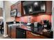 Well-appointed kitchenette with built in microwave, sink, and refrigerator, perfect for easy meal preparation during your stay at 135 E Harmon Ave # 407, Las Vegas, NV 89109