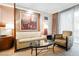 Relaxing living room features a comfortable sofa, stylish chair, and modern decor at 135 E Harmon Ave # 407, Las Vegas, NV 89109