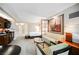Open-concept living area with kitchen, bedroom, seating, and contemporary furnishings at 135 E Harmon Ave # 407, Las Vegas, NV 89109