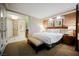 Hotel suite featuring bedroom and bath access, a king-sized bed, and a refreshment bar at 135 E Harmon Ave # 407, Las Vegas, NV 89109