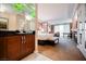 Hotel room with a king bed, a work desk, and a refreshment center with a mirrored accent at 135 E Harmon Ave # 407, Las Vegas, NV 89109