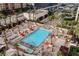 Aerial view of the resort pool with lounge chairs and palm trees at 135 E Harmon Ave # 407, Las Vegas, NV 89109