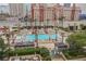 Gorgeous rooftop pool offers a refreshing escape with palm trees and city views at 135 E Harmon Ave # 407, Las Vegas, NV 89109