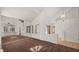 Bright living room with large windows and brown carpet at 2645 Douglas Cir, Henderson, NV 89074