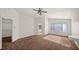 Main bedroom with carpet, large window, and walk-in closet at 2645 Douglas Cir, Henderson, NV 89074