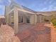 Charming backyard featuring a covered patio, easy care gravel yard and stone-paved walkways at 3408 Isle Dr, Las Vegas, NV 89141