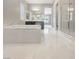 Luxury bathroom features soaking tub, walk-in shower, double vanity, and bright tile floors at 3408 Isle Dr, Las Vegas, NV 89141