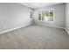Spacious bedroom with neutral carpet, recessed lighting and bright windows with plantation shutters at 3408 Isle Dr, Las Vegas, NV 89141