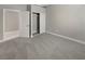 Neutral bedroom with carpet, closet with sliding doors, and access to an ensuite bathroom at 3408 Isle Dr, Las Vegas, NV 89141