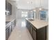 Kitchen island featuring quartz countertops, pendant lighting, and stainless steel appliances at 3408 Isle Dr, Las Vegas, NV 89141