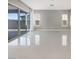 Spacious living room with sliding glass doors and large light tile flooring throughout at 3408 Isle Dr, Las Vegas, NV 89141