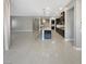 Open concept living space showcasing tile floors, an island, and dark kitchen cabinetry at 3408 Isle Dr, Las Vegas, NV 89141