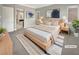 Serene main bedroom with neutral tones, natural light, and access to the ensuite bath at 3408 Isle Dr, Las Vegas, NV 89141