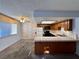 Galley kitchen with wood cabinets and tile countertops at 4140 Gannet Cir # 251, Las Vegas, NV 89103