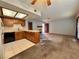 Open concept kitchen and living area with wood cabinets and carpet at 4140 Gannet Cir # 251, Las Vegas, NV 89103