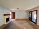 Spacious living room with fireplace and sliding glass doors at 4140 Gannet Cir # 251, Las Vegas, NV 89103