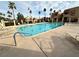 Inviting community pool with lounge chairs and palm trees at 4140 Gannet Cir # 251, Las Vegas, NV 89103