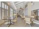 Indoor dining area with tables, chairs, and white shutters at 5421 Broadwater Ln, Las Vegas, NV 89130