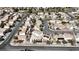 A high angle shot shows a neighborhood with numerous houses and winding streets under a blue sky at 6019 Orca Lilly St, North Las Vegas, NV 89031