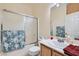 Clean bathroom with tub shower combo, vanity, and mirror at 6019 Orca Lilly St, North Las Vegas, NV 89031