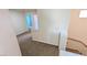 Hallway featuring neutral carpet and paint that leads to rooms in the house at 6019 Orca Lilly St, North Las Vegas, NV 89031